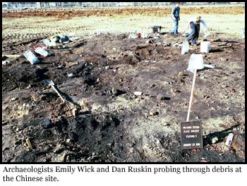 Archaeologist pick through debris